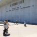 Cyclists ride by the Kennedy Center in Washington