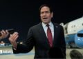 Secretary of State Marco Rubio speaking to reporters after landing in Abu Dhabi