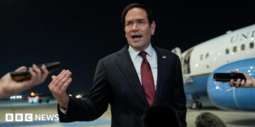 Secretary of State Marco Rubio speaking to reporters after landing in Abu Dhabi