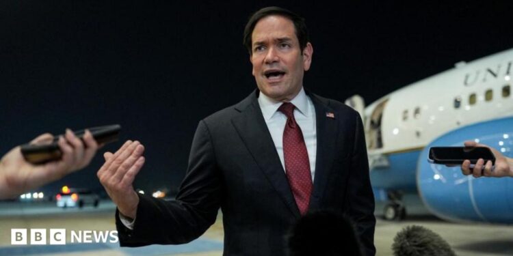 Secretary of State Marco Rubio speaking to reporters after landing in Abu Dhabi
