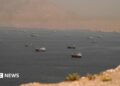 Vessels in the Strait of Hormuz, as seen from Oman on June 18, 2026.