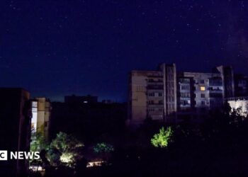 Residential buildings at night during a temporary power outage, which local authorities said was caused by technological disturbances in the peninsula’s energy grid