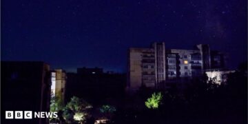 Residential buildings at night during a temporary power outage, which local authorities said was caused by technological disturbances in the peninsula’s energy grid