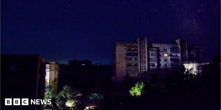 Residential buildings at night during a temporary power outage, which local authorities said was caused by technological disturbances in the peninsula’s energy grid