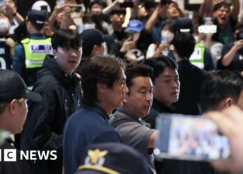 Former South Korea's head coach Hong Myung-bo meet by fans as he arrives at airport
