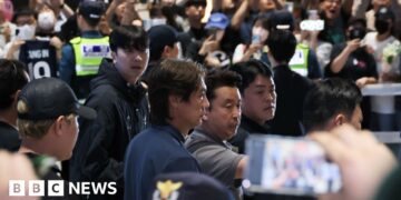 Former South Korea's head coach Hong Myung-bo meet by fans as he arrives at airport