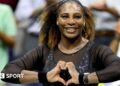 Serena Williams does a heart symbol with her hands while playing at the 2022 US Open