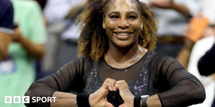 Serena Williams does a heart symbol with her hands while playing at the 2022 US Open