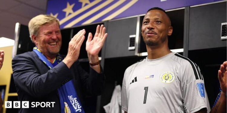 King Willem-Alexander of the Netherlands and Curacao goalkeeper Eloy Room