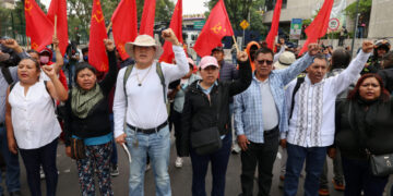 Dissident teachers from Mexico's National Coordination of Education Workers (CNTE) march toward Ciudad de Mexico Stadium
