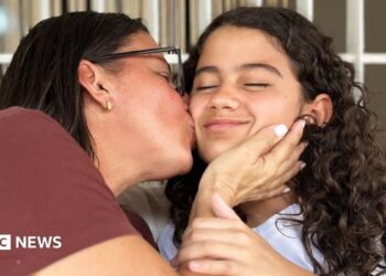 Karina (left) kisses her daughter Fabiana.
