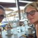 Karovic Ljubisa and his wife Svetlana Grković, smiling for a photo in a bar which appears to be at a holiday resort
