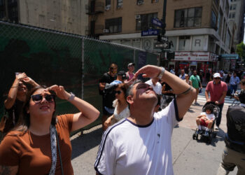 Two people stage a protest atop the Empire State Building in the Manhattan borough of New York