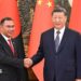 Bangladesh PM Tarique (left) and Chinese President Xi Jinping shaking hands. Behind them there are flags of both countries.