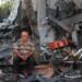 A Palestinian man rests amid debris at the site of an Israeli strike on a house in Gaza City, on July 30, 2026.