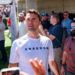 Charlie Kirk in a white T-shirt emblazoned with the word