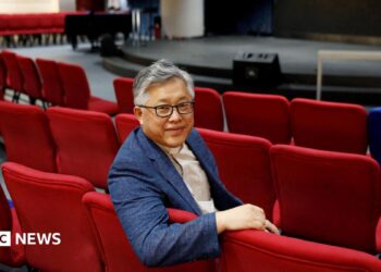 The head pastor of the Zion church in Beijing Jin Mingri poses for picures in the congregation hall of the unofficial Protestant "house" church in Beijing, China, 2018.