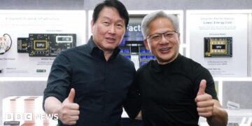 SK Hynix chairman Chey Tae-won and Nvidia boss Jensen Huang posing for a picture with their thumbs up