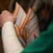 Precinct worker gathers Iowa Democratic Caucus paper ballots for counting after a Democratic presidential Caucus in West D...