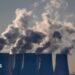 Cooling towers release water vapor at the Jaenschwalde lignite-fired power station in Jaenschwalde, Germany