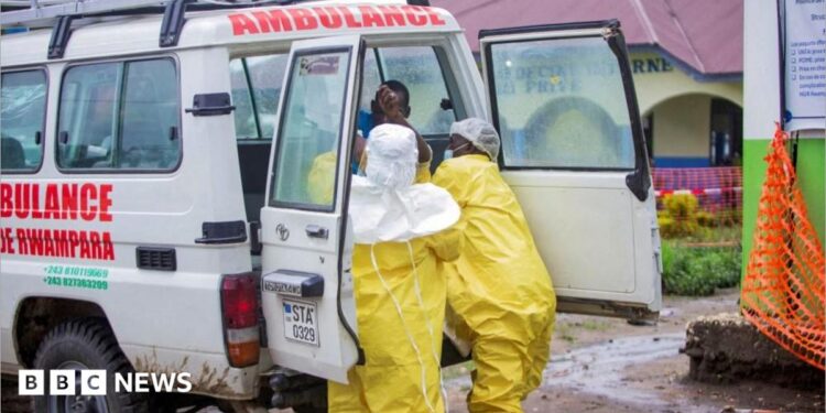Congolese health workers receive a patient at the Rwampara General Hospital