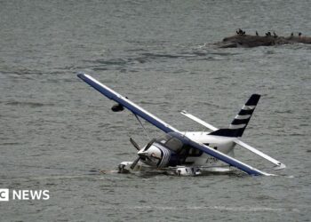 Emergency services on a boat respond to a crashed seaplane in the East River on 5 July 2026 in New York City.