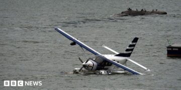 Emergency services on a boat respond to a crashed seaplane in the East River on 5 July 2026 in New York City.