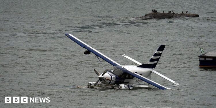 Emergency services on a boat respond to a crashed seaplane in the East River on 5 July 2026 in New York City.