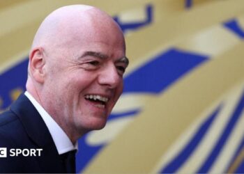 Fifa president Gianni Infantino smiles to the camera