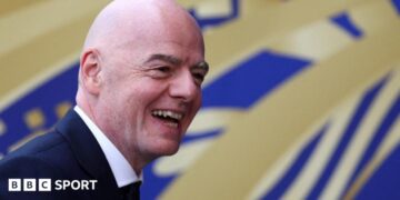 Fifa president Gianni Infantino smiles to the camera