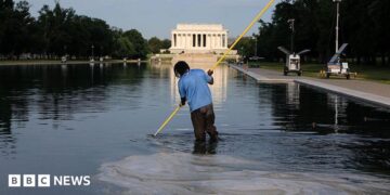 Workers clean the Lincoln Memorial Reflecting Pool on the National Mall on June 25, 2026 in Washington, DC.