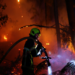 A firefighter works at the scene of a wildfire, in Andernos-les-Bains in the Gironde department, amongst worsening drought conditions following a heatwave and water shortages across much of France, July 26, 2026