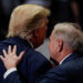 U.S. Senator for South Carolina Lindsey Graham speaks with U.S. President Donald Trump during his campaign rally in Charlotte