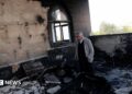 A Palestinian man inspects the damage at a mosque, which Palestinians say was damaged by Israeli settlers, in Qusra near Nablus, in the Israeli-occupied West Bank, July 26, 2026.