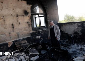 A Palestinian man inspects the damage at a mosque, which Palestinians say was damaged by Israeli settlers, in Qusra near Nablus, in the Israeli-occupied West Bank, July 26, 2026.