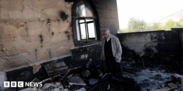 A Palestinian man inspects the damage at a mosque, which Palestinians say was damaged by Israeli settlers, in Qusra near Nablus, in the Israeli-occupied West Bank, July 26, 2026.