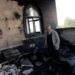 A Palestinian man inspects the damage at a mosque, which Palestinians say was damaged by Israeli settlers, in Qusra near Nablus, in the Israeli-occupied West Bank, July 26, 2026.