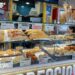 Food stall in Napoli with shelves stocked with sandwiches, pasta, bread, and fried foods