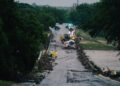First responders on a bridge covered by water after the flood in Kerrville on July 16, 2026.