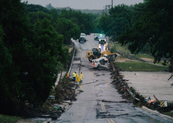 First responders on a bridge covered by water after the flood in Kerrville on July 16, 2026.