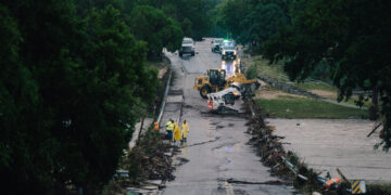First responders on a bridge covered by water after the flood in Kerrville on July 16, 2026.