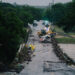 First responders on a bridge covered by water after the flood in Kerrville on July 16, 2026.