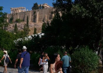 Tourists near the Acropolis in Athens, Greece