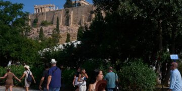 Tourists near the Acropolis in Athens, Greece