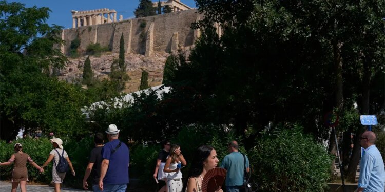 Tourists near the Acropolis in Athens, Greece