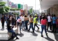 People pictured in a street in San Salvador, El Salvador's capital, following an evacuation