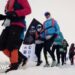 Runners set off from the snowy starting line in full thermal gear and goggles