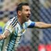 Lionel Messi celebrating with his arms out for Argentina