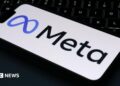 The Meta logo is displayed on a mobile phone