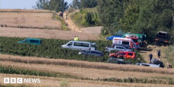 Emergency services work at the site where an unidentified flying object, believed to be a Russian cruise missile, as Ukraine's foreign minister said on Thursday, fell after violating Polish airspace